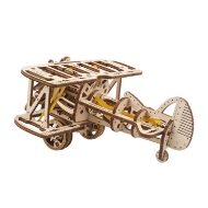 Side view of small wooden model of a biplane, assembled, made of wooden parts that were laser cut from thin wood.