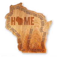 Wisconsin cribbage board made of wood and cut out in the shape of the state with engraved pine trees and the world "HOME" in bold font across the top of the state.