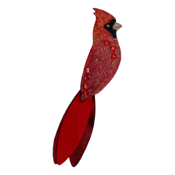 Red brooch in shape of cardinal. Hand carved from natural gourd.