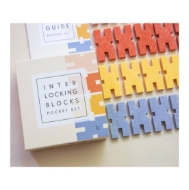 Pocket set of interlocking felt blocks. Colored felt blocks displayed next to product box.