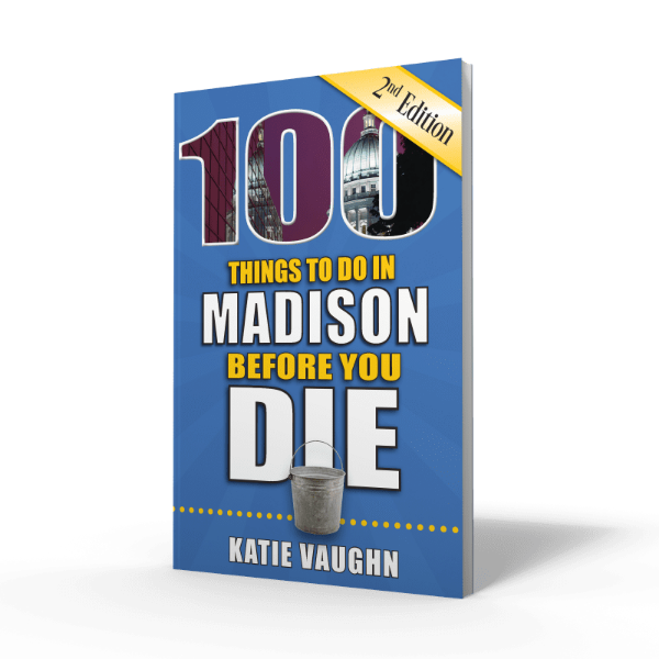 Book cover of "100 Things to do in Madison Before You Die." Blue cover with title in large, bold, yellow and white font. 