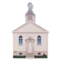 Facade of historic St. Peter's Catholic white church as it appears on the miniature home decor piece. Two arched windows, left and right of the entrance, and a steeple atop.