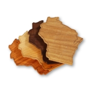 Set of four wooden coasters cut in the shape of Wisconsin. Four different woods in tones from dark to light displayed in a fan shape, overlapping like a hand of cards.. 