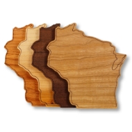 Set of four wooden coasters cut in the shape of Wisconsin. Four different woods in tones from dark brown to light tan.