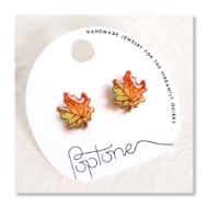 Two stud earrings in the shape of maple leaves, red and green tones. Mounted on white display card