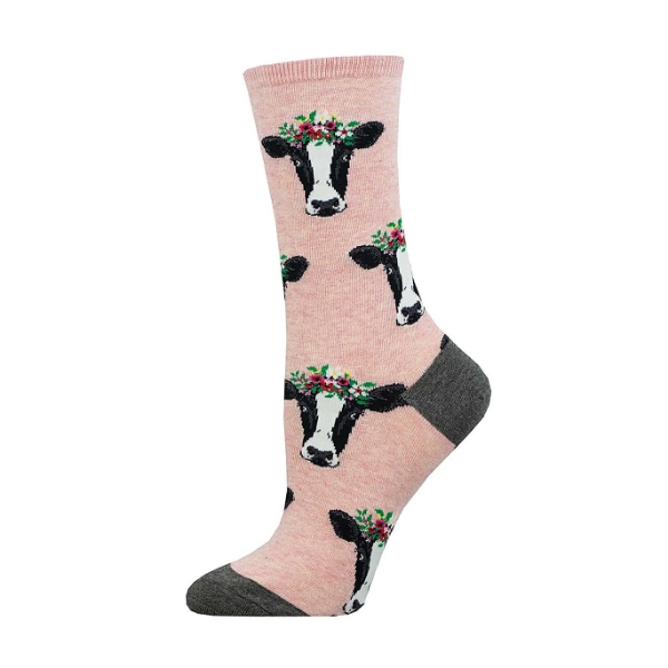 Pink crew sock with multiple cow faces in black and white.  Brown heal and toe.
