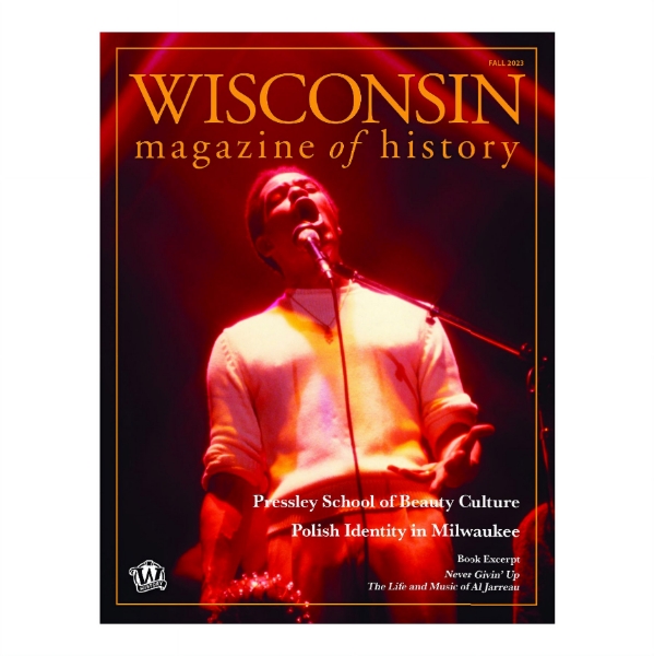 Cover of Wisconsin Magazine of History Fall 2023 with concert photo of singer Al Jarreau signing under red lighting.