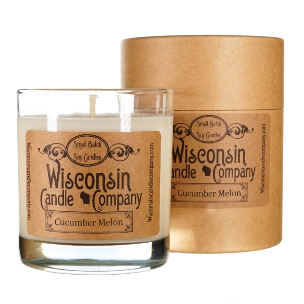 White wax candle in cylindrical clear glass container with kraft-paper label. Black font says Wisconsin Candle Company.
