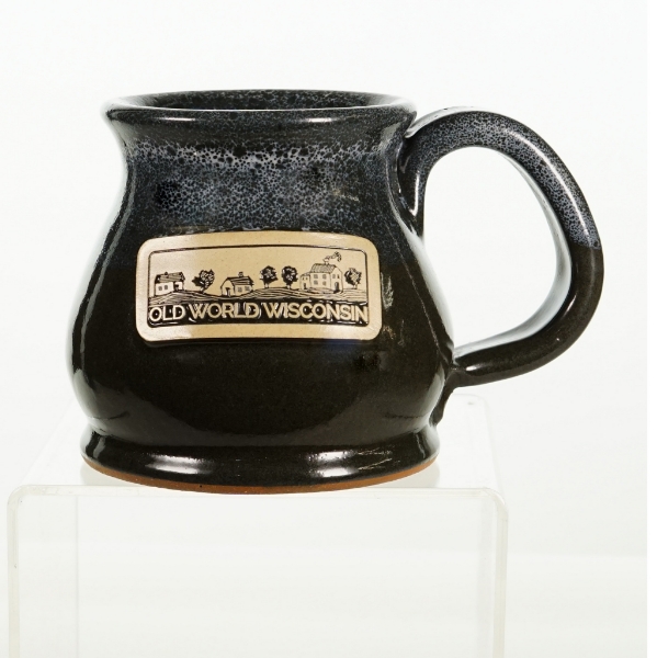 Darkly glazed "potbelly" style stoneware mug with Old World Wisconsin  farm landscape design on side.