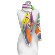 Multicolored scarf tied around white mannequin form. The scarf has "March Balloons" design by Frank Lloyd Wright.