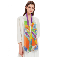 Female model wearing multicolored sheer scarf. The scarf has a geometric "March Balloons" design by Frank Lloyd Wright.