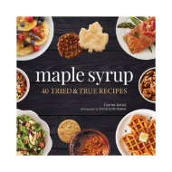 Book cover of "Maple Syrup: 40 Tried and True Recipes" with title in bold white, center, surrounded by plates of food. Dark brown background.