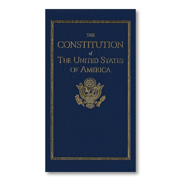 "Constitución de Los Estados Unidos De América is written in gold on a dark blue background