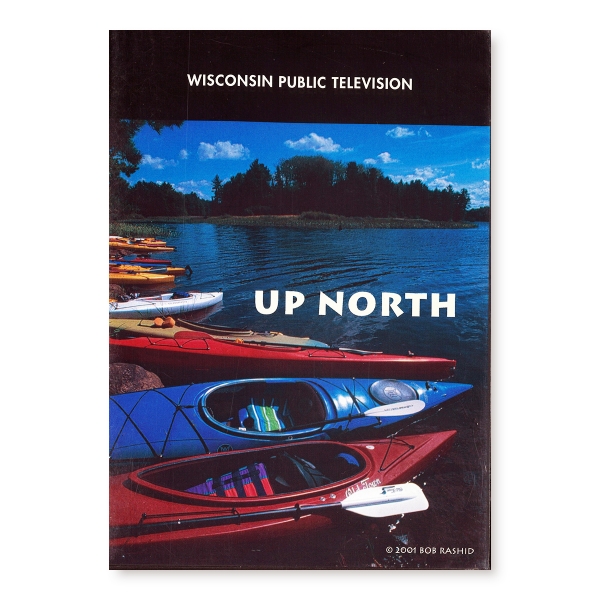 Cover of "Up North" DVD with color photo of kayaks on shore of lake in summer.