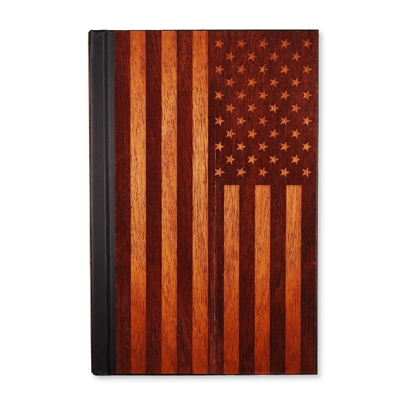 A picture of the journal with the American flag as the cover. It is made of wood.