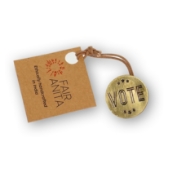 The front of the brass vote pin