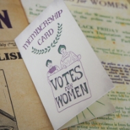 The front of the packaging for the "Votes for Women" Ribbon Enamel Pin