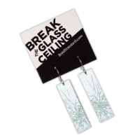 The long Break the Glass Ceiling earrings in its packaging