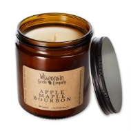 The Apple Maple Bourbon 16 oz candle in brown glass container, open, with black tin screw top leaning on side.