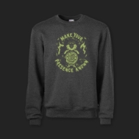 Dark gray sweatshirt with glow-in-the-dark "Halloween" design featuring a witch, candles, flames, a skull, and the words "Make Your Presence Known."