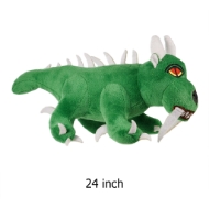 Green stuffed animal hodag monster toy with white horns and fangs.