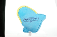 The back side of the Madeline Island home decor plush souvenir, light blue, with the site name and logo in the center.