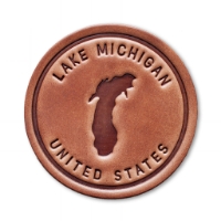 The front of the Lake Michigan Leather Coaster on a blank white background