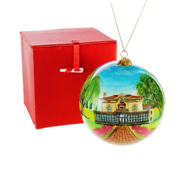 The other side of the Villa Louis glass ornament with the red gift box on a white background