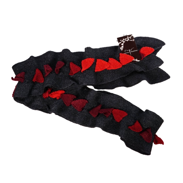 Spiked scarf by K. Gereau Textiles. A black scarf with a long row of fabric "spikes" down the center in shades of red.