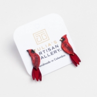 The Red Cardinal Stud Earrings in its packaging on a blank white background