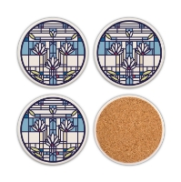 Four round beverage coasters with "Waterlilies" design by Frank Lloyd Wright. One coaster overturned to show cork backing.