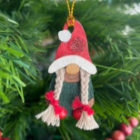 The Mrs. Gnome Holiday Ornament hanging on a Christmas tree