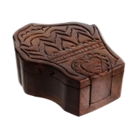 Brown wooden puzzle box in the shape of Wisconsin, shown from a side angle.