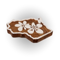 A side view of the wooden Wisconsin shaped magnet outlined in white with white wood violets painted in the middle. 